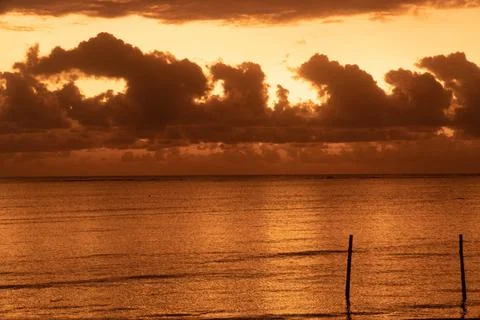 Cloudy Sunrise At The Beach Stock Photos