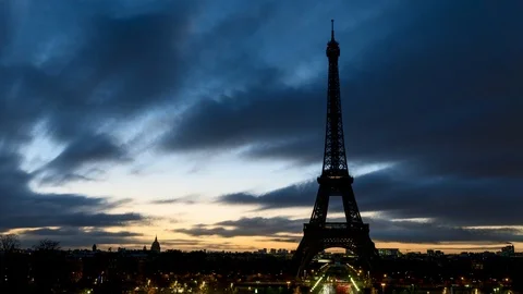 Cloudy sunrise over Eiffel tower in winter - Paris Stock Footage
