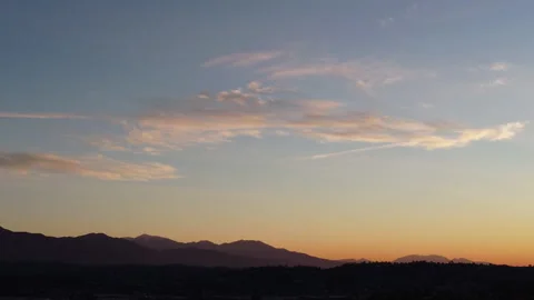 Cloudy Sunrise over Mountains - Drone / Aerial Stock Footage 146350557