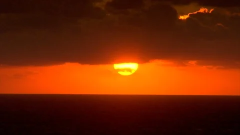 Cloudy sunrise over ocean. Bright orange sky Stock Footage 106842834