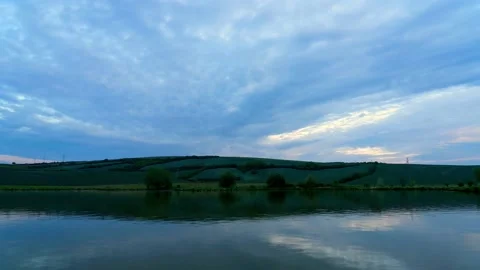 Cloudy sunrise over small pond during summer day. Stock Footage 130559031
