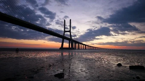 Cloudy sunrise over the Vasco da Gama Bridge. Lisbon, Portugal Stock Footage 113610421