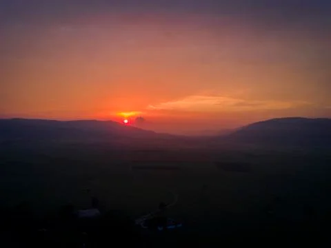 Cloudy sunrise Stock Photos