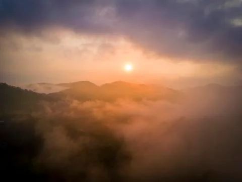 Cloudy sunrise Stock Photos