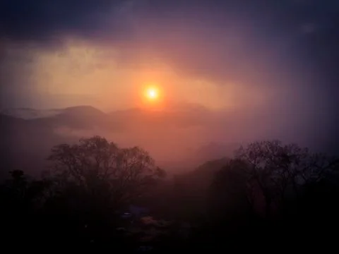 Cloudy sunrise Stock Photos