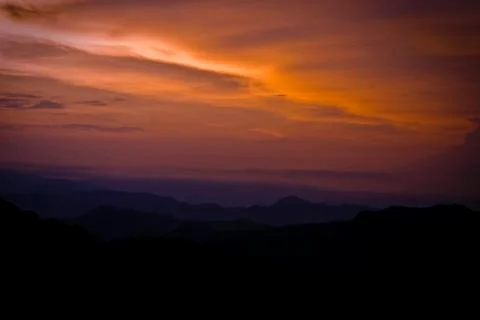 Cloudy sunrise Stock Photos