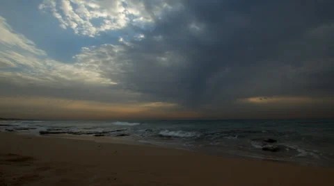 Cloudy Sunset on a chilly, sandy shorline Stock Footage 34370036