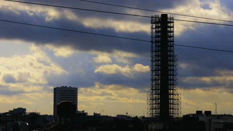 Cloudy sunset with chimney under construction_timelapse Stock Footage 153167858