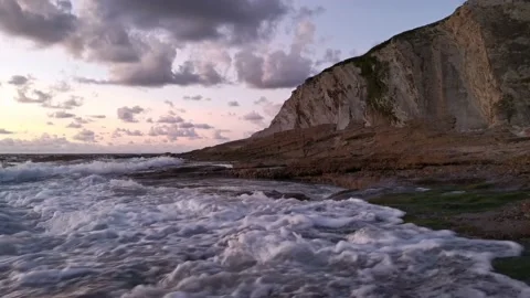 Cloudy sunset on the coast Video stock 135353627