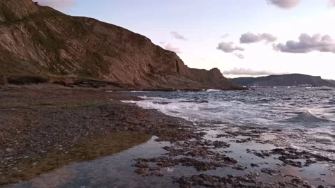 Cloudy sunset on the coast Stock Footage 135353824