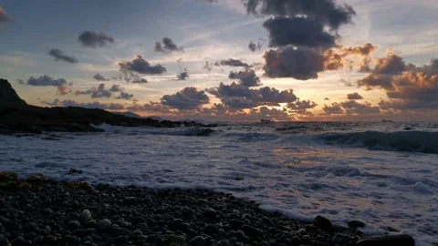 Cloudy sunset on the coast Stock Footage 135353850