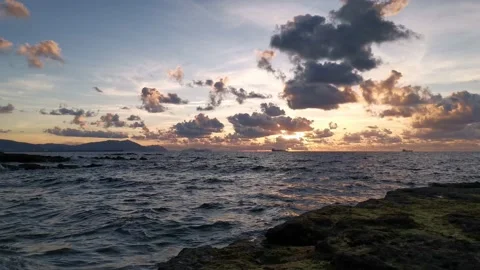 Cloudy sunset on the coast Stock Footage 135353920