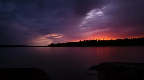 Cloudy sunset in a midsummer night at lake Vänern in Sweden Stock Footage 51382565