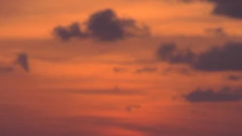 Cloudy sunset with orange sky Stock Photos