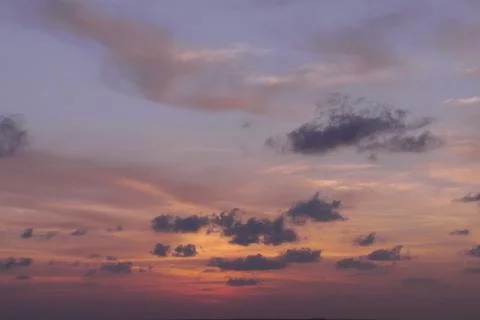 Cloudy sunset with orange sky Stock Photos