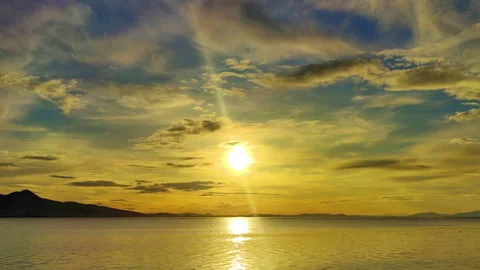 Cloudy Sunset over Calm Sea Water Stock Footage 302220227