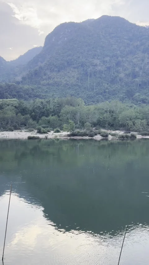 Cloudy Sunset Over River and Boats in Muang Ngoi, Laos Video stock 310802911