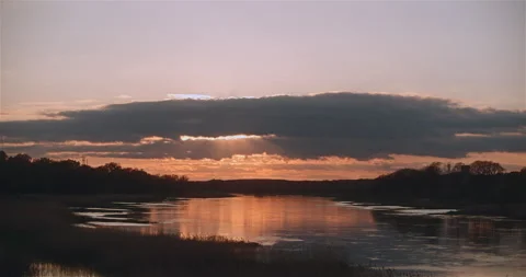 Cloudy sunset over the river Stock Footage 242787196