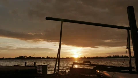 Cloudy sunset over the river on water processing station of rubber factory Stock Footage 143563270