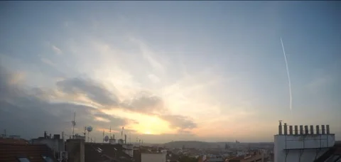 Cloudy sunset over roofs in Prague with Prague Castle in back,4 times time-lapse Video stock 56473391