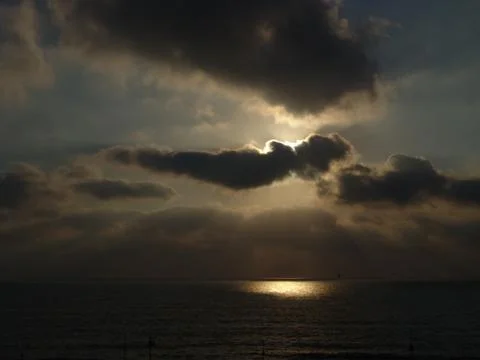 Cloudy sunset over a sandy beach ocean Stock-Fotos