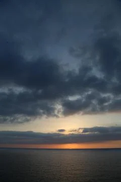 Cloudy Sunset over sea Stock Photos