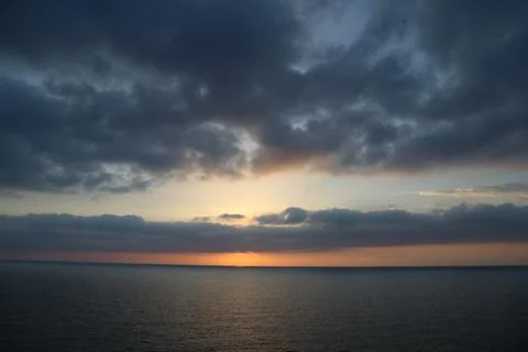 Cloudy Sunset over sea Stock Photos