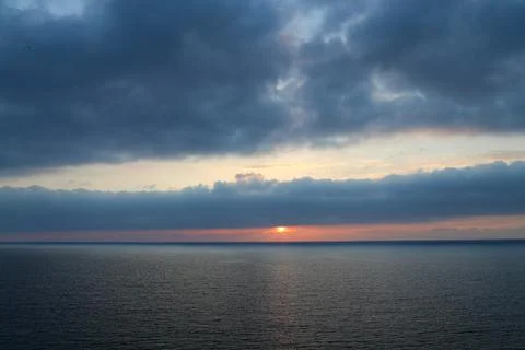 Cloudy Sunset over sea Stock Photos