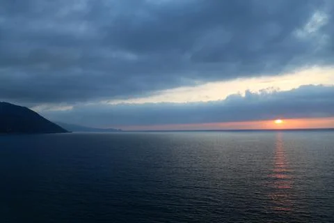 Cloudy Sunset over sea Stock Photos