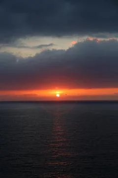 Cloudy Sunset over sea Stock Photos