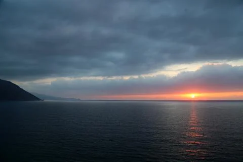 Cloudy Sunset over sea Stock Photos