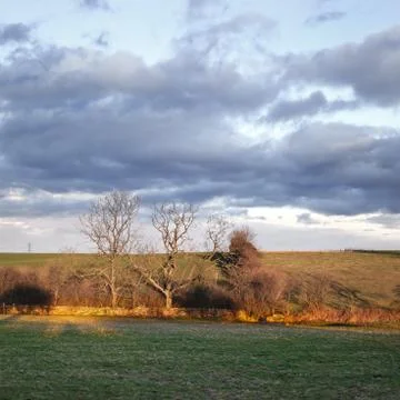 Cloudy sunset Stock Photos
