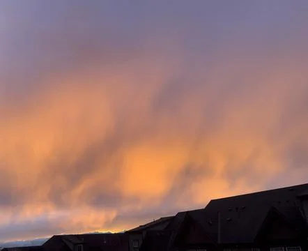 A cloudy sunset with pink clouds Stock Photos