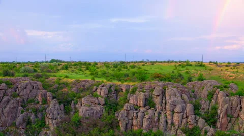 Cloudy Sunset with Rainbow. Stock Footage 64890014