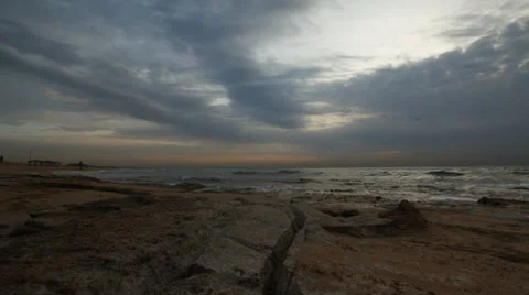 Cloudy Sunset on a rocky chilly shorline Stock Footage 34369428