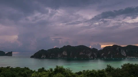 Cloudy sunset sky, clouds over the mountains. Sea bay with turquoise water. Stock Footage 267184052