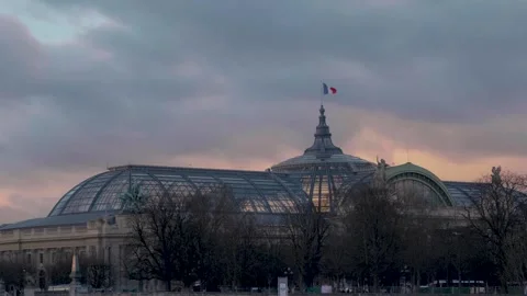 Cloudy sunset sky over the Grand Palais in Paris Stock Footage 305582560
