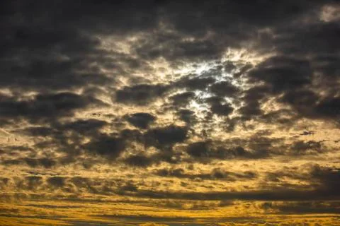 Cloudy sunset in the sky Stock Photos