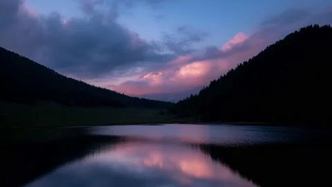 Cloudy sunset timelapse on a lake Stock Footage