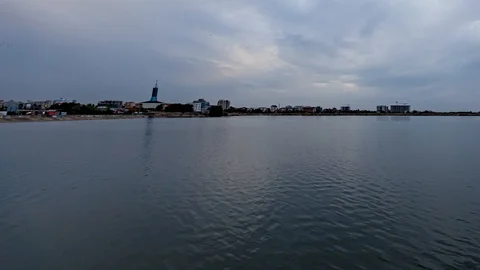 Cloudy Sunset Timelapse over Water Motion Background Stock Footage 117159072