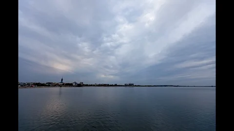 Cloudy Sunset Timelapse Over Water Motion Background Seamless Loop Stock Footage 127668459