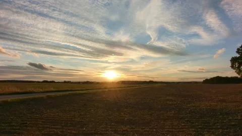 Cloudy sunset on a windy evening with dramatic sky colors. Stock Footage 317579715