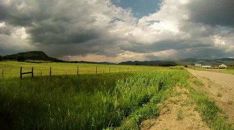 Cloudy Time Lapse Over Green Feild Stock Footage 47064721