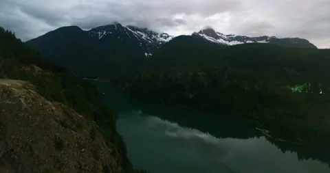 Cloudy time lapse over snowy mountains and lake Stock Footage 165240119