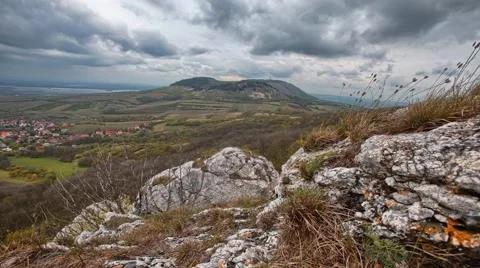 Cloudy time lapse with rock and hill Stock Footage 67582537