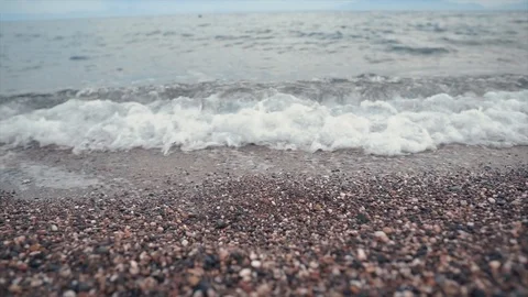 Cloudy time on Mediterranean beach. Rocks, sand and sea.  Stock Footage 109124801