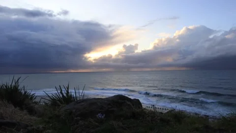 Cloudy timelapse over the ocean at sunrise Stock Footage 209866470