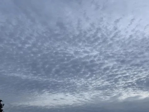 Cloudy twilight sky over a tranquil landscape Stock Photos