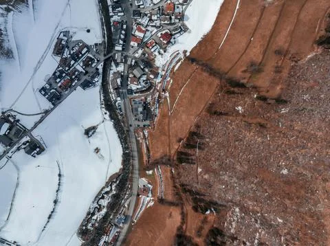 Cloudy valley if the Alpine village and the ski resort in Tyrol, Italy. Stock Photos