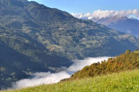 Cloudy valley in mountain Stock Photos